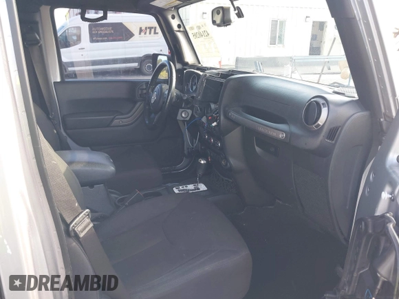 2018 Jeep Wrangler Unlimited Sport S with VIN 1C4HJWDG5JL839703, listed as a IAAI auction lot 42140205 with 61,604 mi miles and . Bid and sale history available at DreamBid. Image 5.