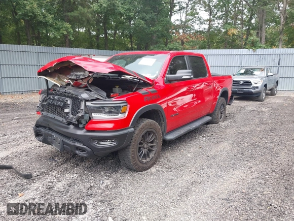 2021 Ram 1500 Rebel with VIN 1C6SRFLT2MN591844, listed as a IAAI auction lot 40410248 with 84,759 mi miles and . Bid and sale history available at DreamBid. Image 17.