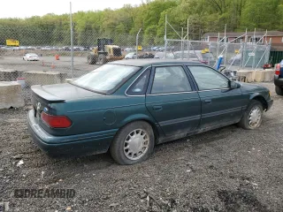 1995 Ford Taurus GL with VIN 1FALP52U8SA179395, listed as a Copart auction lot 53614265 with 71,082 mi miles and Salvage title. Bid and sale history available at DreamBid. Image 3.