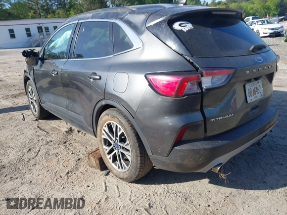 2020 Ford Escape Titanium Hybrid with VIN 1FMCU9DZ2LUA86600, listed as a IAAI auction lot 42059830 with 76,998 mi miles and . Bid and sale history available at DreamBid. Image 3.