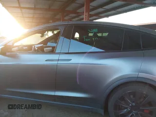 2022 Tesla Model X Plaid z VIN 7SAXCBE69NF352875, wystawiony jako IAAI lot #41964970 z przebiegiem 34 065 mil mil oraz . Historia ofert i sprzedaży dostępna na DreamBid. Obrazek 15.