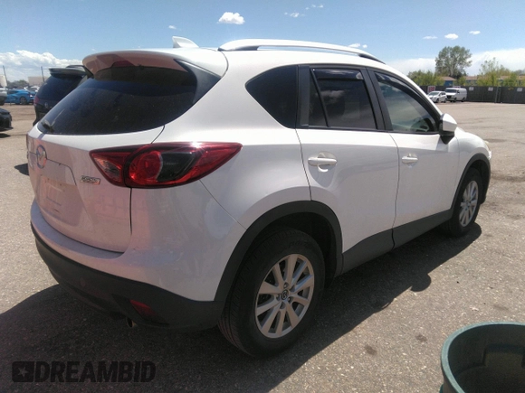 2014 Mazda CX-5 Touring with VIN JM3KE2CY7E0364311, listed as a IAAI auction lot 42108176 with 90,506 mi miles and . Bid and sale history available at DreamBid. Image 4.