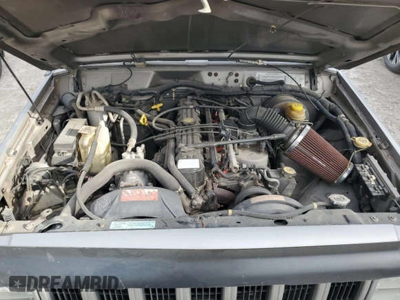 2001 Jeep Cherokee Sport z VIN 1J4FF58SX1L576572, wystawiony jako Copart lot #48982965 z przebiegiem 174 500 mil mil oraz Szkoda całkowita • Salvage title. Historia ofert i sprzedaży dostępna na DreamBid. Obrazek 13.