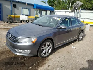 2014 Volkswagen Passat SEL Premium with VIN 1VWCN7A33EC054699, listed as a Copart auction lot 62407855 with 115,078 mi miles and Salvage title. Bid and sale history available at DreamBid. Image 1.