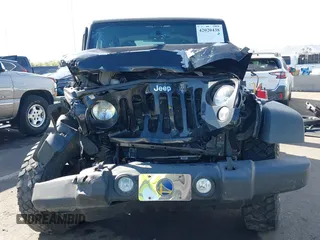 2014 Jeep Wrangler Sport with VIN 1C4AJWAG7EL100344, listed as a IAAI auction lot 42020438 with 87,279 mi miles and . Bid and sale history available at carsss.com. Image 12.