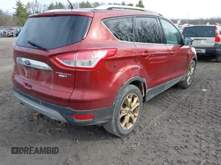2015 Ford Escape Titanium with VIN 1FMCU9JX1FUA56091, listed as a IAAI auction lot 41947035 with 191,297 mi miles and . Bid and sale history available at DreamBid. Image 4.