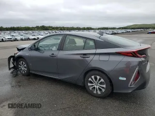 2021 Toyota Prius LE z VIN JTDKAMFP1M3172737, wystawiony jako Copart lot #57056205 z przebiegiem Nie podano mil oraz Szkoda całkowita • Salvage title. Historia ofert i sprzedaży dostępna na DreamBid. Obrazek 2.