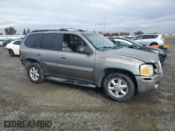 2005 GMC Envoy SLT with VIN 1GKDS13S852320018, listed as a Copart auction lot 80496544 with 237,451 mi miles and Salvage Title. Bid and sale history available at carsss.com. Image 4.