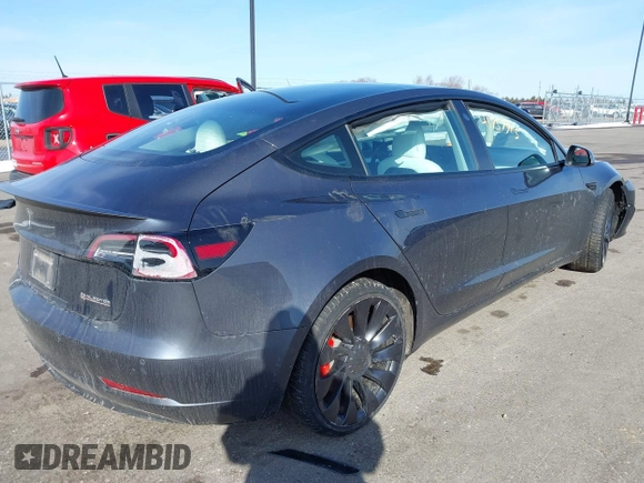 2021 Tesla Model 3 Performance with VIN 5YJ3E1EC3MF082532, listed as a IAAI auction lot 41757905 with 60,431 mi miles and . Bid and sale history available at DreamBid. Image 4.