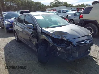 2014 Hyundai Accent GLS with VIN KMHCT4AEXEU710606, listed as a IAAI auction lot 41764163 with 103,859 mi miles. Bid and sale history available at carsss.com. Image 1.