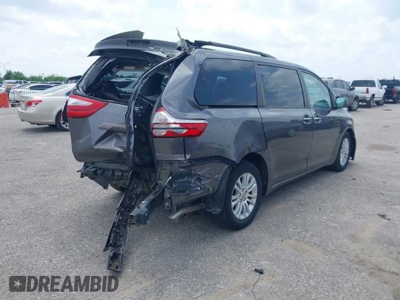 2015 Toyota Sienna XLE with VIN 5TDYK3DCXFS688971, listed as a IAAI auction lot 42127912 with 143,024 mi miles. Bid and sale history available at carsss.com. Image 4.