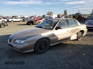 1996 Pontiac Grand Am SE2 with VIN 1G2NE52T3TC834038, listed as a Copart auction lot 76610794 with 140,379 mi miles and Salvage Title. Bid and sale history available at carsss.com. Image 1.