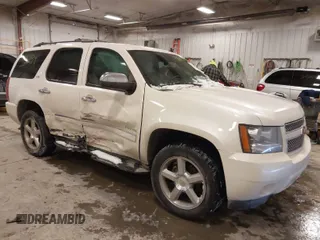 2013 Chevrolet Tahoe LTZ with VIN 1GNSKCE03DR101927, listed as a IAAI auction lot 41613734 with 135,529 mi miles and . Bid and sale history available at DreamBid. Image 1.