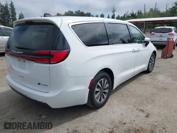 2023 Chrysler Pacifica Hybrid Touring L with VIN 2C4RC1L77PR541513, listed as a IAAI auction lot 42433421 with 53,979 mi miles and . Bid and sale history available at DreamBid. Image 4.