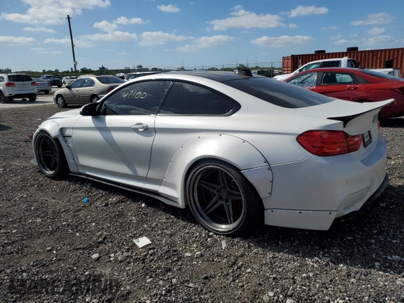 2015 BMW M4 with VIN WBS3R9C58FK330635, listed as a Copart auction lot 50525664 with 47,100 mi miles. Bid and sale history available at carsss.com. Image 2.