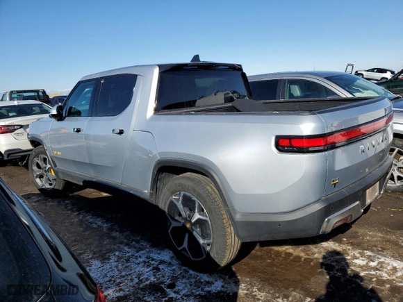 2023 Rivian R1T Adventure with VIN 7FCTGAAA5PN017311, listed as a Copart auction lot 42523755 with 35,039 mi miles and Salvage Title. Bid and sale history available at carsss.com. Image 2.