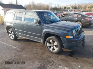 2014 Jeep Patriot Latitude with VIN 1C4NJRFB4ED720241, listed as a IAAI auction lot 40914199 with 128,218 mi miles. Bid and sale history available at carsss.com. Image 1.