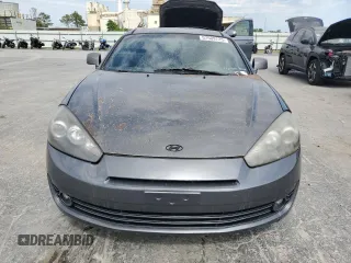 2007 Hyundai Tiburon GS z VIN KMHHM66D47U243846, wystawiony jako Copart lot #57509725 z przebiegiem 181 941 mil mil oraz Szkoda całkowita • Salvage title. Historia ofert i sprzedaży dostępna na DreamBid. Obrazek 5.