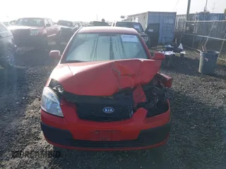 2009 Kia Rio LX with VIN KNADE223796485606, listed as a IAAI auction lot 41676881 with 58,852 mi miles and . Bid and sale history available at DreamBid. Image 12.
