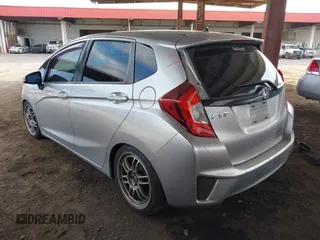 2015 Honda Fit LX with VIN 3HGGK5G52FM764205, listed as a IAAI auction lot 42641420 with 104,783 mi miles and . Bid and sale history available at DreamBid. Image 3.