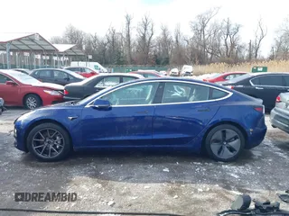 2018 Tesla Model 3 Long Range Battery with VIN 5YJ3E1EB8JF115138, listed as a IAAI auction lot 41343399 with 62,351 mi miles and . Bid and sale history available at DreamBid. Image 15.