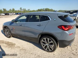 2021 BMW X2 xDrive28i with VIN WBXYJ1C04M5S07696, listed as a Copart auction lot 73412384 with 35,004 mi miles and Salvage Title. Bid and sale history available at carsss.com. Image 2.