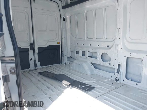 2023 Ford Transit Cargo with VIN 1FTBR1X80PKB45974, listed as a IAAI auction lot 42609404 with 35,940 mi miles and . Bid and sale history available at DreamBid. Image 8.