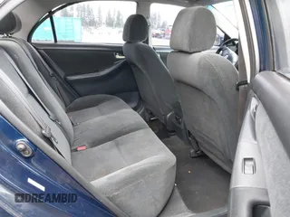 2003 Toyota Corolla CE with VIN 1NXBR32E83Z084375, listed as a IAAI auction lot 41915211 with 299,999 mi miles and . Bid and sale history available at DreamBid. Image 8.