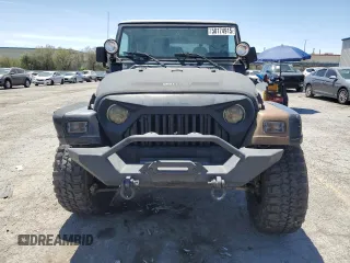 1999 Jeep Wrangler Sahara with VIN 1J4FY49S8XP472733, listed as a Copart auction lot 58174915 with 170,838 mi miles and Salvage title. Bid and sale history available at DreamBid. Image 5.