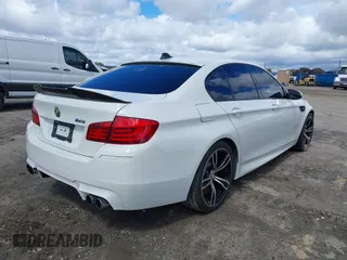 2013 BMW M5 with VIN WBSFV9C56DC772961, listed as a IAAI auction lot 41765457 with 104,568 mi miles. Bid and sale history available at carsss.com. Image 4.