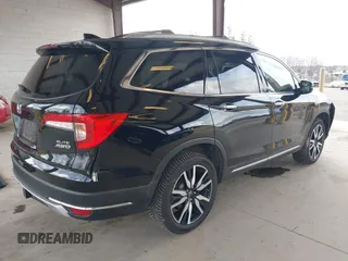 2021 Honda Pilot Elite with VIN 5FNYF6H04MB043014, listed as a IAAI auction lot 41826931 with 63,546 mi miles and . Bid and sale history available at DreamBid. Image 4.
