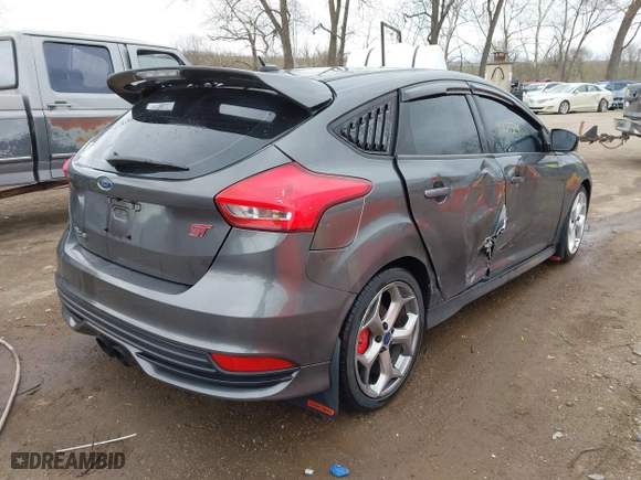 2015 Ford Focus ST with VIN 1FADP3L93FL321830, listed as a IAAI auction lot 41835529 with 106,901 mi miles. Bid and sale history available at carsss.com. Image 4.