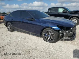 2024 BMW i5 eDrive40 with VIN WBY33FK09RCR50159, listed as a Copart auction lot 55520615 with 12,564 mi miles and Salvage title. Bid and sale history available at DreamBid. Image 4.
