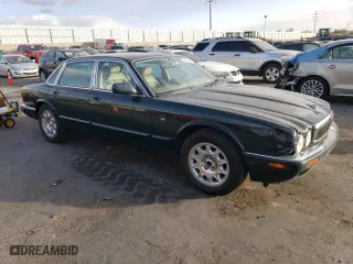 1999 Jaguar XJ with VIN SAJHD1048XC867723, listed as a Copart auction lot 76745444 with 170,999 mi miles and Salvage Title. Bid and sale history available at carsss.com. Image 4.