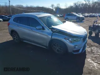 2018 BMW X1 xDrive28i with VIN WBXHT3C36J5L33781, listed as a IAAI auction lot 41497360 with 61,251 mi miles. Bid and sale history available at carsss.com. Image 1.