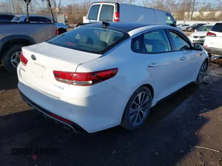 2016 Kia Optima SX Turbo with VIN 5XXGW4L29GG037932, listed as a IAAI auction lot 41800068 with 16,387 mi miles and . Bid and sale history available at carsss.com. Image 4.