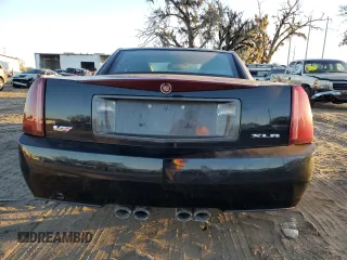 2006 Cadillac XLR z VIN 1G6YX36D965602114, wystawiony jako Copart lot #80151794 z przebiegiem Nie podano mil oraz Szkody całkowita. Historia ofert i sprzedaży dostępna na DreamBid. Obrazek 6.
