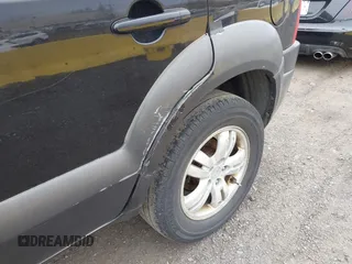2007 Hyundai Tucson SE with VIN KM8JN12D77U667867, listed as a IAAI auction lot 42082092 with 240,911 mi miles. Bid and sale history available at carsss.com. Image 12.