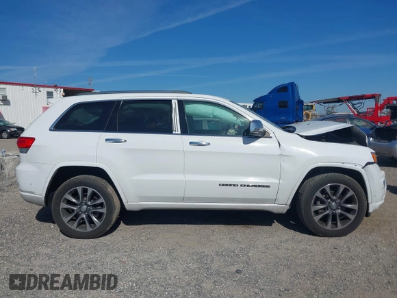 2017 Jeep Grand Cherokee Overland z VIN 1C4RJECG5HC959981, wystawiony jako IAAI lot #41638958 z przebiegiem 102 122 mil mil oraz . Historia ofert i sprzedaży dostępna na DreamBid. Obrazek 13.
