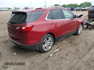 2018 Chevrolet Equinox Premier z VIN 2GNAXMEV3J6329268, wystawiony jako IAAI lot #42240907 z przebiegiem 61 487 mil mil oraz . Historia ofert i sprzedaży dostępna na DreamBid. Obrazek 4.