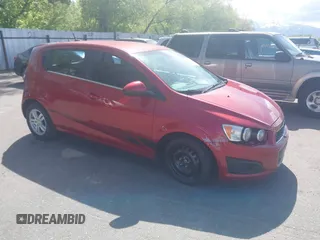 2012 Chevrolet Sonic LT with VIN 1G1JC6SB7C4211053, listed as a IAAI auction lot 42137692 with 157,278 mi miles and . Bid and sale history available at DreamBid. Image 1.