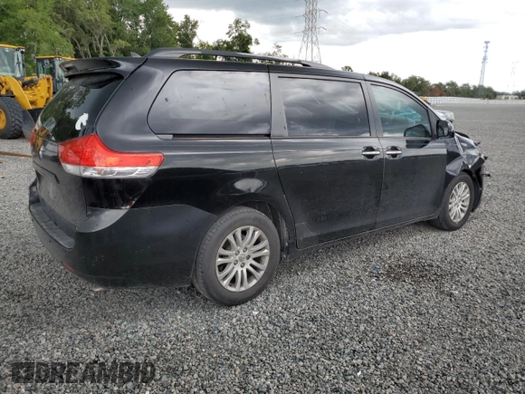 2012 Toyota Sienna XLE AAS with VIN 5TDYK3DC1CS279236, listed as a Copart auction lot 63329165 with 143,937 mi miles and Salvage title. Bid and sale history available at DreamBid. Image 3.