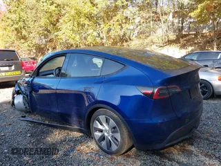 2024 Tesla Model Y Long Range with VIN 7SAYGDEE1RA266328, listed as a IAAI auction lot 40610351 with 13,573 mi miles. Bid and sale history available at carsss.com. Image 3.