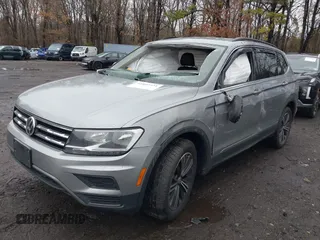 2021 Volkswagen Tiguan SE with VIN 3VV2B7AX8MM100651, listed as a IAAI auction lot 41803931 with 69,405 mi miles and . Bid and sale history available at DreamBid. Image 6.
