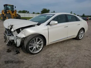2014 Cadillac XTS Premium z VIN 2G61P5S38E9248632, wystawiony jako Copart lot #54989185 z przebiegiem 33 820 mil mil oraz Szkoda całkowita • Salvage title. Historia ofert i sprzedaży dostępna na DreamBid. Obrazek 1.
