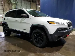 2015 Jeep Cherokee Trailhawk with VIN 1C4PJMBS7FW609741, listed as a Copart auction lot 55991595 with 125,711 mi miles and Clean title. Bid and sale history available at DreamBid. Image 4.
