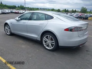 2014 Tesla Model S 60 with VIN 5YJSA1S13EFP53662, listed as a IAAI auction lot 42249930 with Not provided miles and . Bid and sale history available at DreamBid. Image 3.