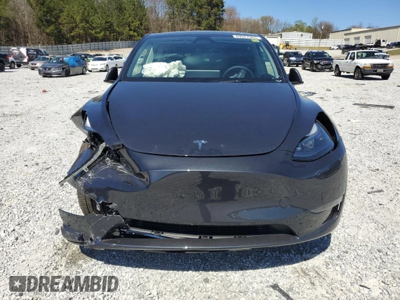 2025 Tesla Model Y Long Range with VIN 7SAYGAEEXSF253326, listed as a Copart auction lot 49527965 with 5,803 mi miles and Salvage Title. Bid and sale history available at DreamBid. Image 5.