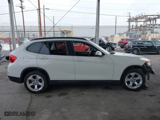 2015 BMW X1 sDrive28i with VIN WBAVM1C53FV318663, listed as a IAAI auction lot 41711526 with 182,204 mi miles. Bid and sale history available at carsss.com. Image 13.