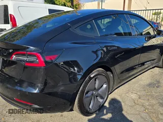 2021 Tesla Model 3 Standard Range Plus with VIN 5YJ3E1EA1MF871146, listed as a Copart auction lot 55633575 with 72,492 mi miles and Salvage Title. Bid and sale history available at DreamBid. Image 4.